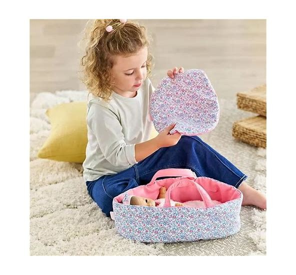 Inside this wonderfully soft cloth bed is plenty of space for your favorite 12-inch baby doll to rest comfortably, plus a thick double-sided blanket to keep them nice and warm. Ready to go? Just grab the carrying handles and head out the door! Toys. Dolls &amp; Dollhouses. Pretend Play &amp; Imaginative Play.