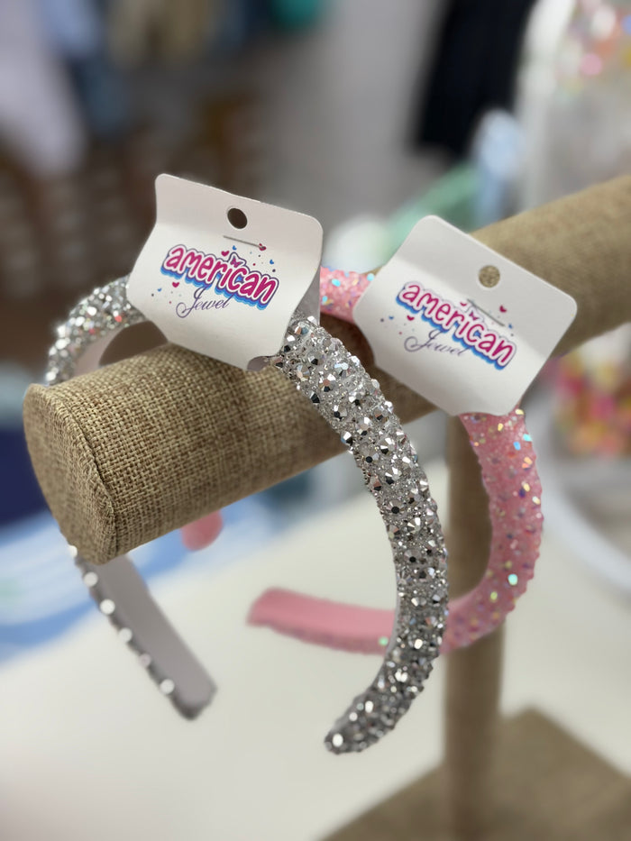 Add a touch of sparkle to your little one's style with the Rhinestones Headband by American Jewel! Available in charming pink or silver, this adorable accessory is perfect for toddler to tween girls. It’s a delightful gift that radiates sass and cuteness, making every outfit shine!

SOLD SEPERATELY