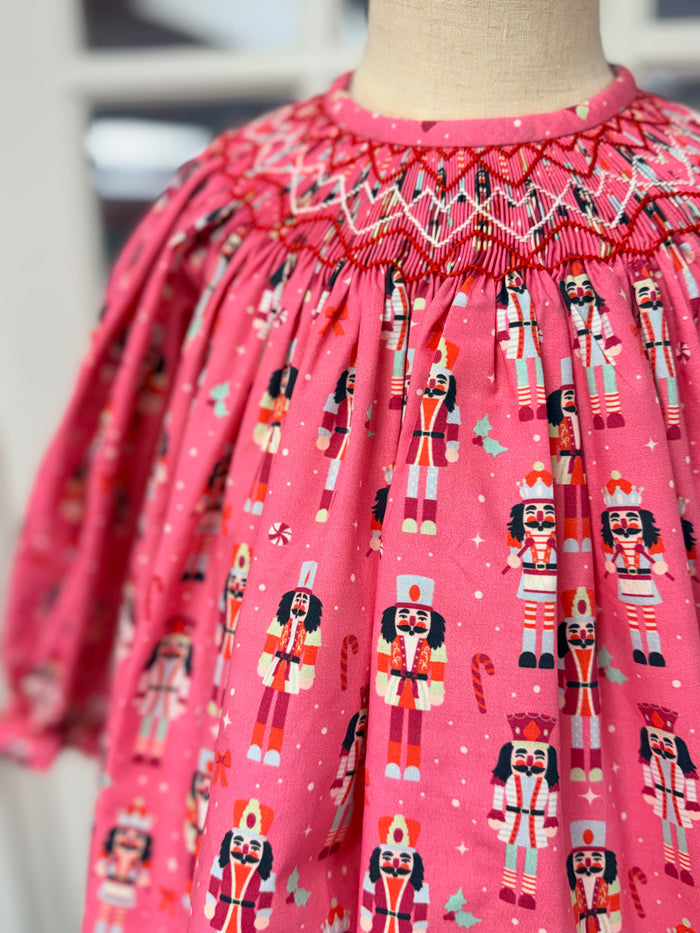 Celebrate the season with Cape Point Clothing Co.’s Nutcracker Bishop Pant Set! A charming pink nutcracker blouse paired with cozy pink corduroy pants wraps your toddler in warmth and festive joy, making chilly days feel magical and stylish. Perfect for creating unforgettable holiday memories.