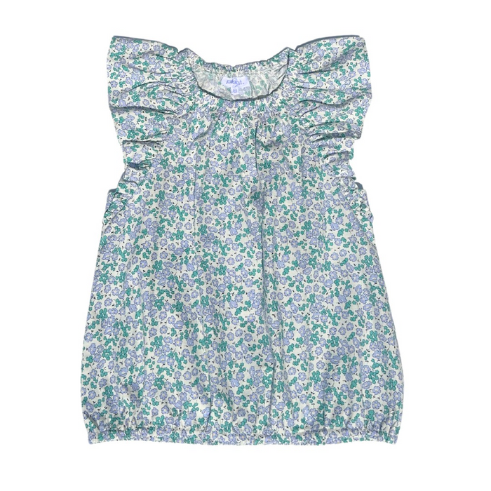 This girl's Allie Meadow Top from Pleat features a soft green and blue floral print, delicate ruffle shoulders, and cap sleeves for a charming and feminine look. The blousy feel adds comfort and ease, making it perfect for any occasion. Pair it with the coordinating tiered skirt for a complete and stylish outfit.