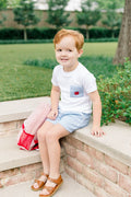 Dress your little boy in the charming Apple Pocket Shirt Short Set by The Proper Peony. The soft white Pima cotton shirt, featuring an adorable apple pocket, pairs perfectly with light blue shorts. It's not just stylish—it's incredibly comfortable, making it ideal for school days or playful adventures!