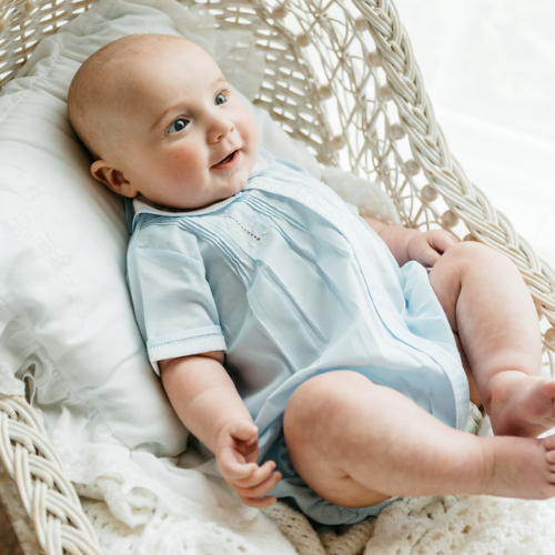 Introduce your little one to a world of charm with the Blue Button Front Dot Creeper by Feltman Brothers. This classic, timeless design is perfect for infant boys, ensuring they look utterly adorable while enjoying comfort and ease. Dress your baby in a style that celebrates tradition and elegance!