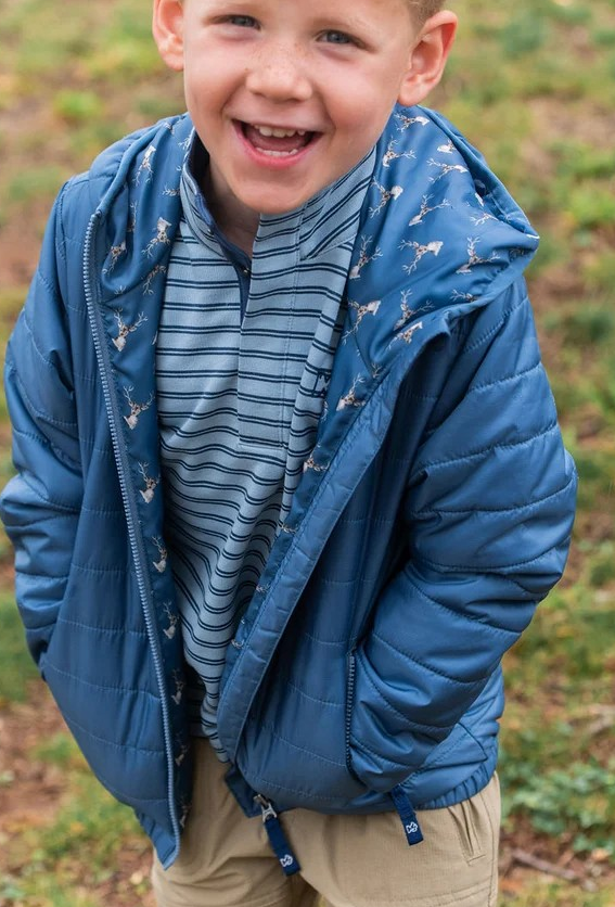 Boys Hooded Puffer Jacket from Prodoh in blue. This sporty layer combines warmth, comfort, and rugged durability. Designed to keep up with every move, it easily transitions from playground recess to weekend trail outdoor exploration.