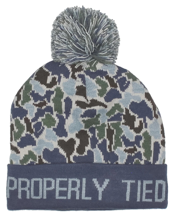 Properly Tide’s Boys Breck Beanie in Terra Camo provides head warmth with a playful touch. Featuring a knitted design and deep fit, this cuffed beanie is designed to keep you comfortable with a layer of warmth around your head. Along with the pattern, a pom-pom at the top adds a fun and finishing detail, making this beanie something your boy can’t go out in the cold without!