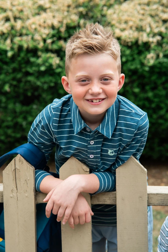Meet your new favorite classic: the Boys' Long Sleeve Cotton Polo in Tapestry Blue and Mist Green Stripe. Designed from a premium blend of cotton and spandex for all-day comfort and just the right amount of stretch. Whether he's headed to church, school, or the golf course with Dad, this polo allows him to look polished and playful at the same time.