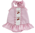 Experience the joyful spirit of summer with the Cherry Jubilee Bathing Suit by Bailey Boys! This delightful pink seersucker design, adorned with charming cherries, ensures your little one stands out at the beach or pool. The precious drop hem ruffle and halter tie neck add a touch of playful elegance, making every splash a memorable moment!