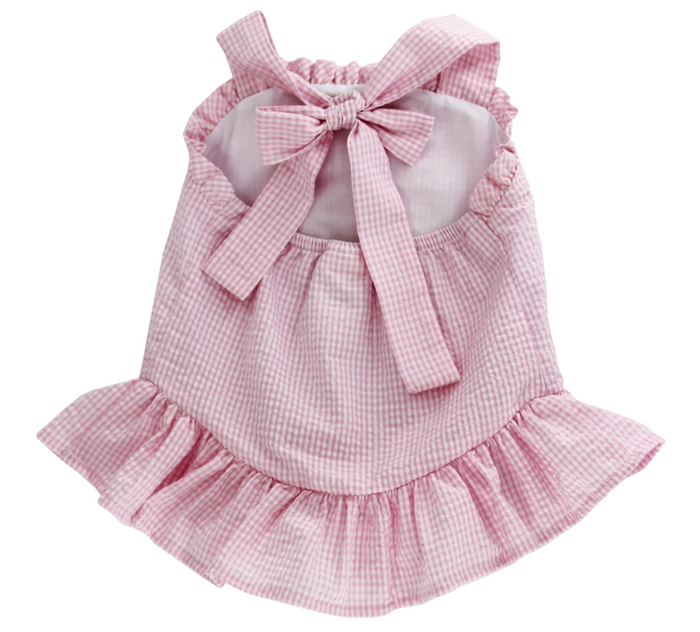 Experience the joyful spirit of summer with the Cherry Jubilee Bathing Suit by Bailey Boys! This delightful pink seersucker design, adorned with charming cherries, ensures your little one stands out at the beach or pool. The precious drop hem ruffle and halter tie neck add a touch of playful elegance, making every splash a memorable moment!