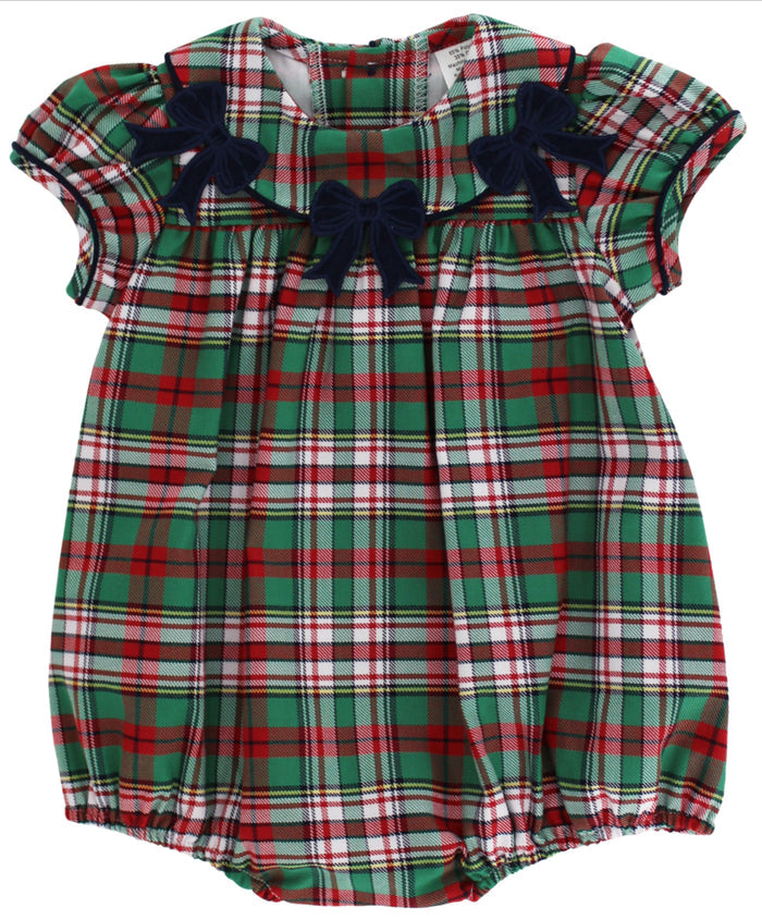 Bailey Boys’ Christmas Plaid Girls Bubble celebrates timeless holiday charm with its classic plaid and adorable navy bows. This short-sleeved bubble dress creates a cozy, elegant look for your little one, perfectly paired with white socks and a cardigan to make holiday moments unforgettable.