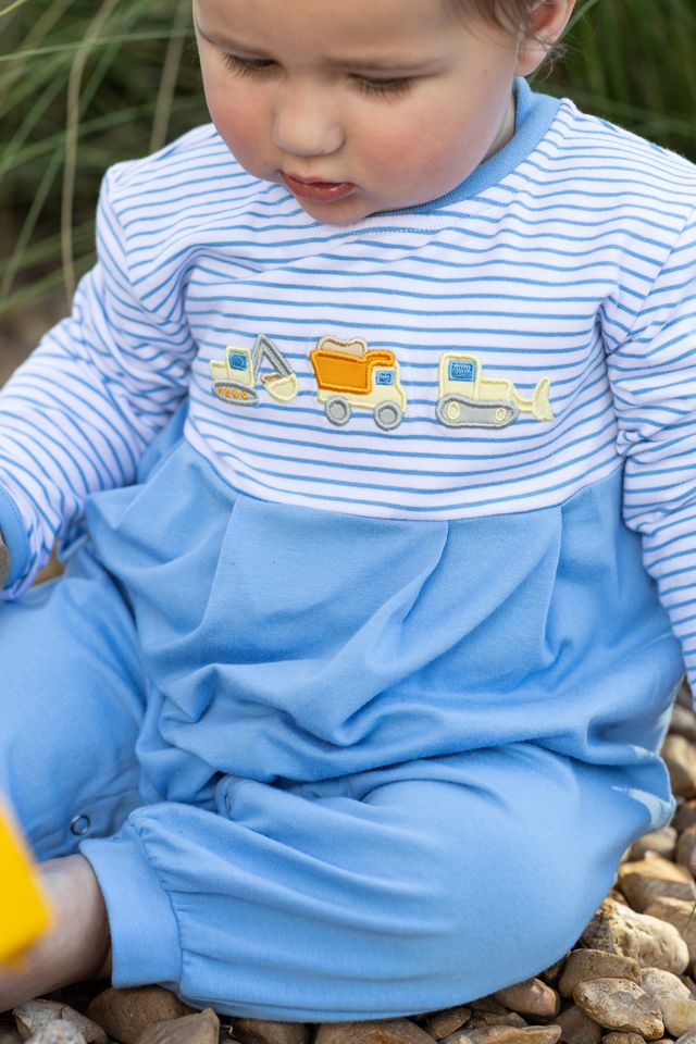 Dress your little builder in the Construction Trucks Romper by Trotter Street Kids! Soft, cozy fabric with charming truck appliqués and autumn-ready long sleeves and pants make it the perfect outfit to keep your baby boy comfortable and adorable all season long.