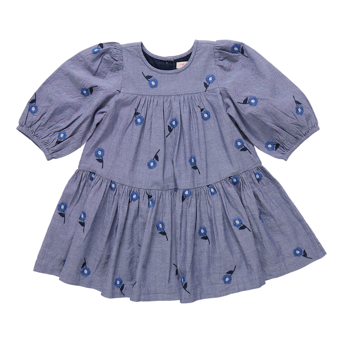 The Girls Fiona Dress in Blue Blossom Embroidery features vibrant embroidered blossom patterns that make your girl truly stand out. Designed with comfort and style in mind, this dress allows for easy movement while adding a magical touch to any occasion. Perfect for celebrations or everyday adventures, it brings a charming blend of elegance and playful style to her wardrobe.
