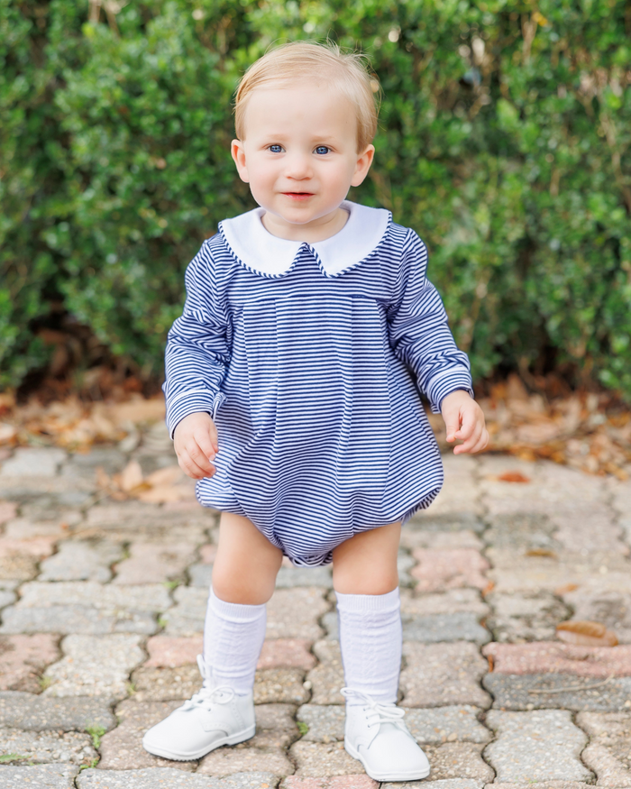 Dress your little one in timeless charm with the Henry Bubble in Navy Stripes by Jellybean! The soft navy stripes paired with the crisp white Peter Pan collar create a classic look that’s as comfortable as it is adorable. Ready to make every moment unforgettable?