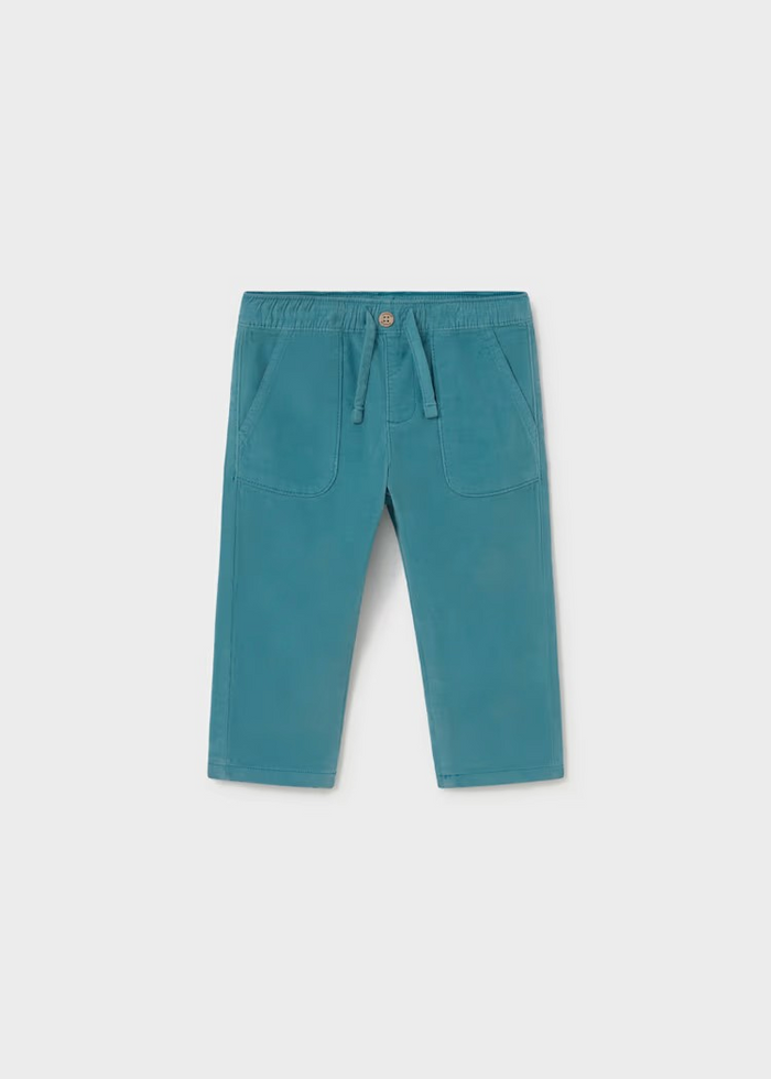 Soft corduroy infant pants in a rich teal tone, crafted with a cozy striped jersey lining for all-day comfort. The fabric make these an everyday essential that pairs beautifully with the Mayoral Bear Sweater for a coordinated look. Perfect for layering through seasons, these pants bring texture and warmth to your little one's wardrobe.