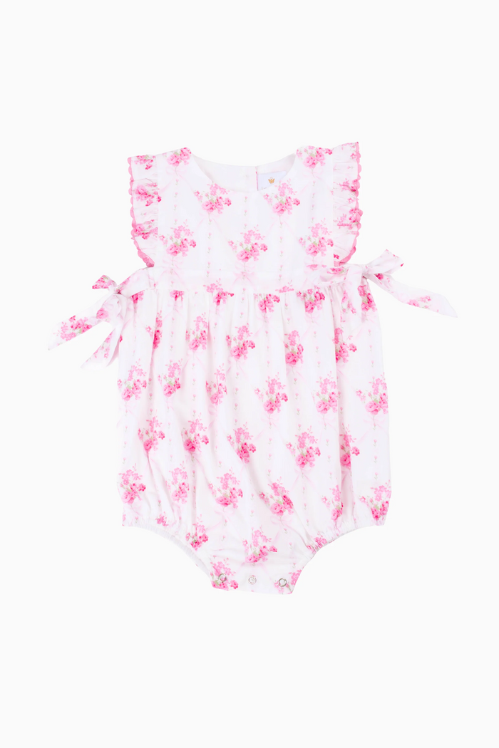 Introducing the Infant Girls Hallie Baby Bubble from J. Marie—a charming pink and white floral sundress. This whimsical style features a vibrant pink floral print that captures the essence of carefree summer days. Perfect for everything from playdates to family gatherings, the Hallie bubble pairs effortlessly with sandals and sun hats for an on-trend look that keeps up with active infants. Soft, breathable fabric ensures all-day wear, making it an instant favorite for warm-weather wardrobes.