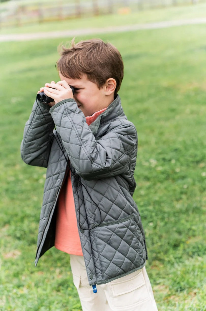 For the kid who loves wide-open spaces and muddy adventures, the&nbsp;Kids Quilted Barn Jacket in Fly Fishing Green&nbsp;is a countryside classic reimagined for modern explorers. Designed with a tailored fit, diamond-quilted finish, and rugged detailing, this jacket brings cozy warmth and timeless style from pumpkin patch to pasture.