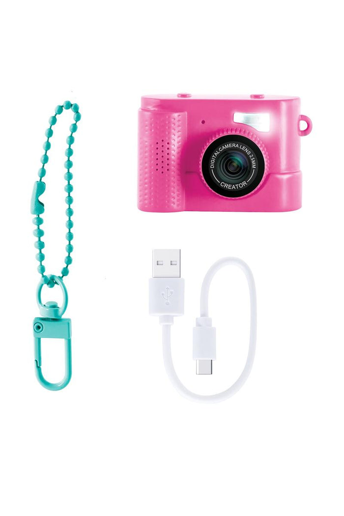 The Photo Creator Mini Camera gives kids a real photo and video experience in a tiny, easy-to-use design made just for them. Small enough to clip onto a backpack, this kid-friendly camera lets young creators capture everyday moments while exploring creativity on the go. It feels like real tech, but plays like a toy.