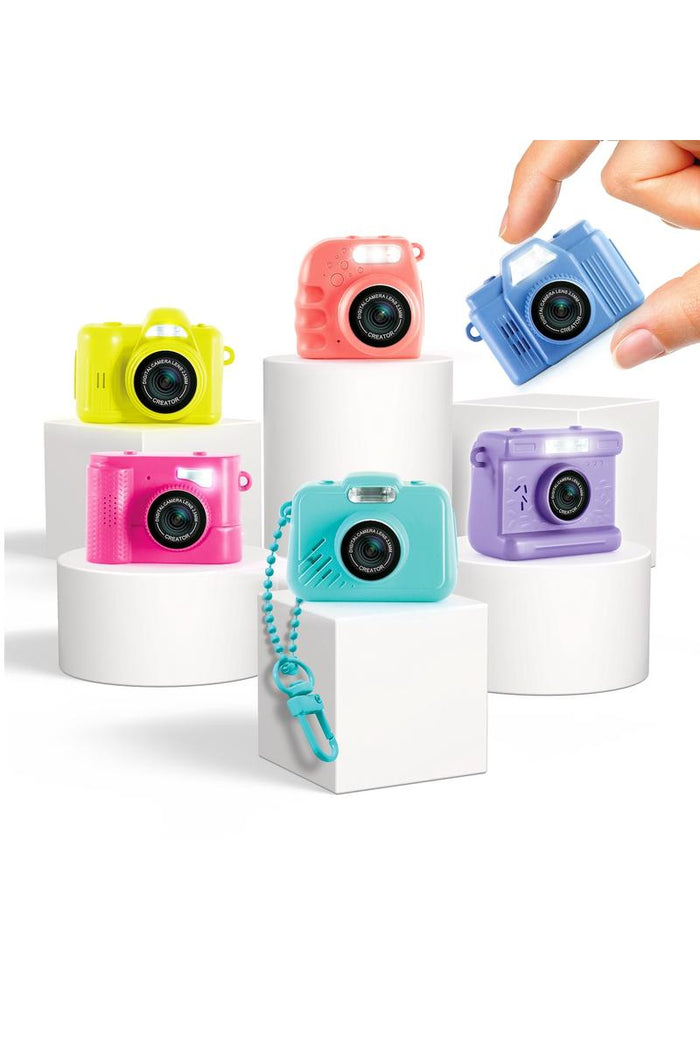 The Photo Creator Mini Camera gives kids a real photo and video experience in a tiny, easy-to-use design made just for them. Small enough to clip onto a backpack, this kid-friendly camera lets young creators capture everyday moments while exploring creativity on the go. It feels like real tech, but plays like a toy.