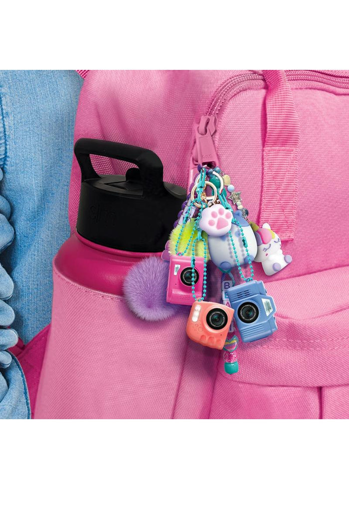 The Photo Creator Mini Camera gives kids a real photo and video experience in a tiny, easy-to-use design made just for them. Small enough to clip onto a backpack, this kid-friendly camera lets young creators capture everyday moments while exploring creativity on the go. It feels like real tech, but plays like a toy.