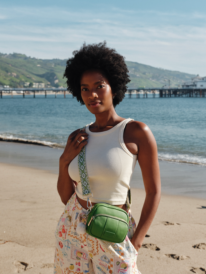 Frog Green Original Mini Bag showing exterior pockets and gold hardware | Pom Pom London
