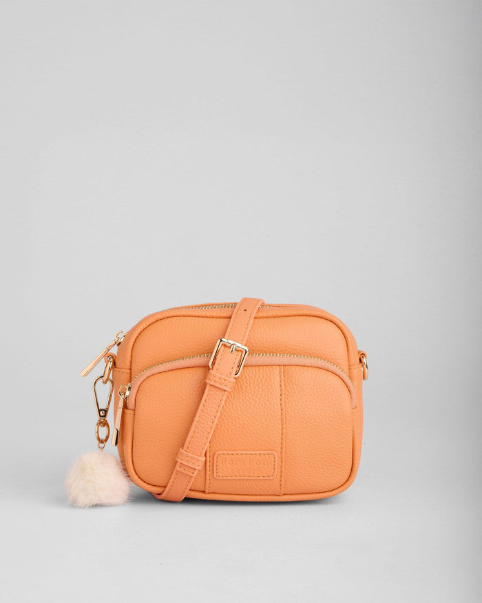 Original Mini Bag in Mango Tango full-grain leather close-up | Pom Pom London