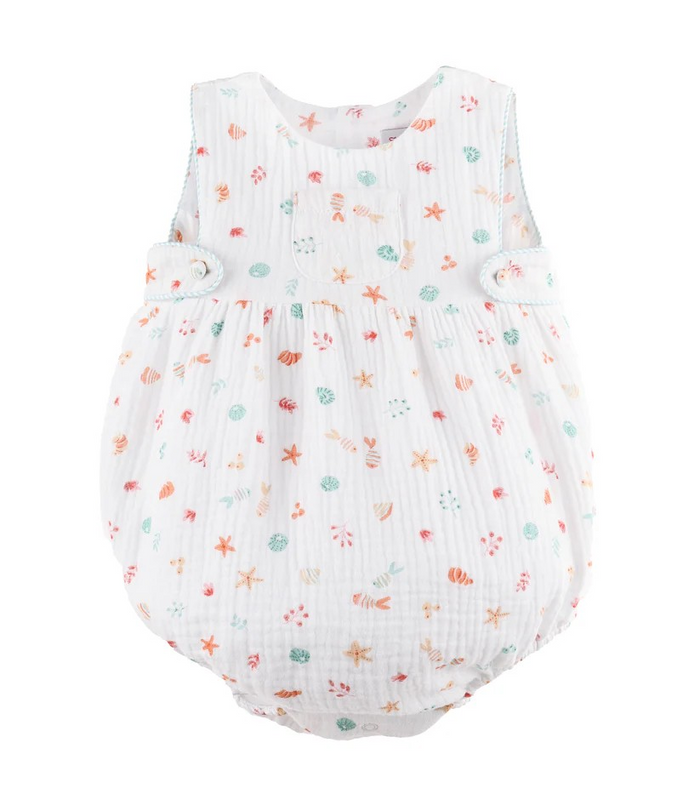Soft muslin bubble perfect for warm weather play. This infant boy's style features a charming summer coastal print with shells and fish on a crisp white background. Thoughtful details include striped piping trim, convenient side tabs for easy dressing, and an adorable front pocket. Breathable fabric keeps little ones comfortable all season long.