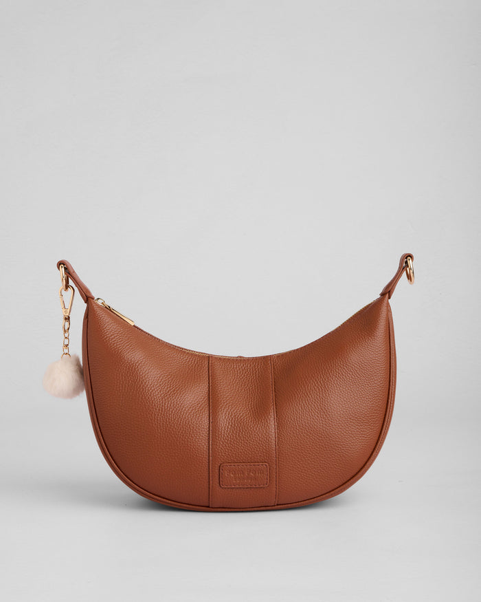 Sutton Sling Bag in Chestnut full-grain leather close-up | Pom Pom London