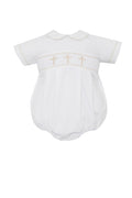 The perfect Easter outfit for your little one! Our White Poplin Boys Cross Embroidered Bubble from Petit Bebe features beautiful gold crosses embroidered across the bodice, a classic peter pan collar, and short sleeves. This delicate and elegant design is perfect for any religious ceremony or special occasion.